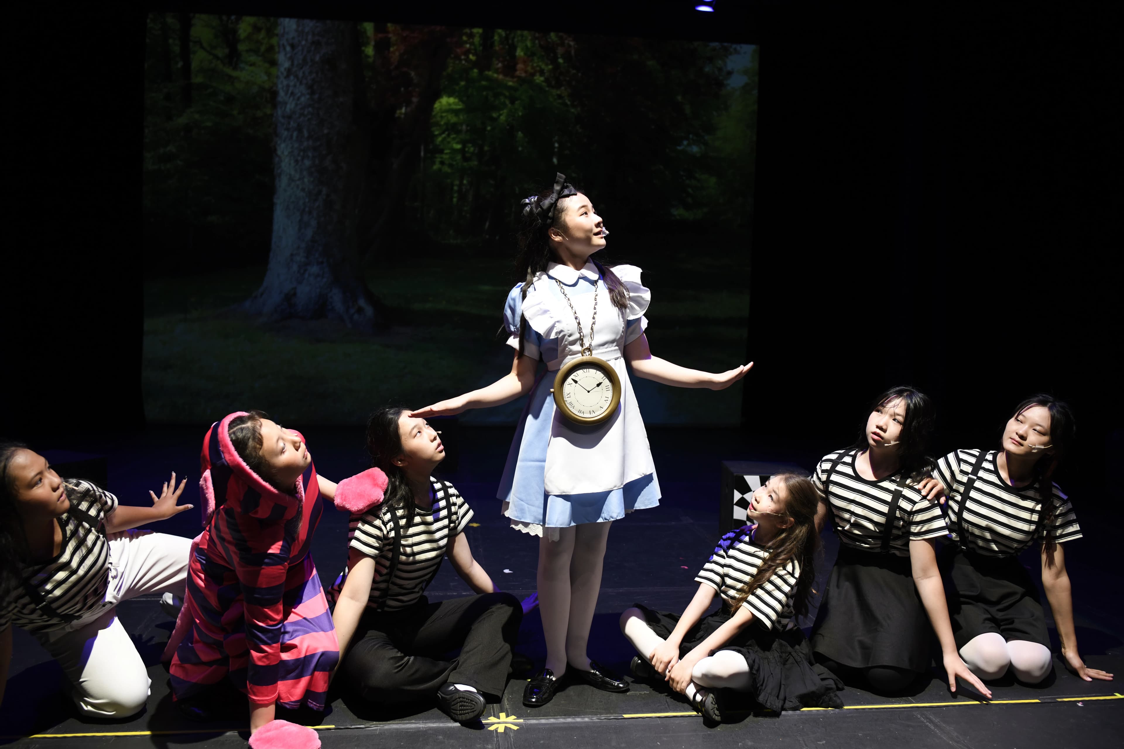 TADA students performing in Alice in Wonderland