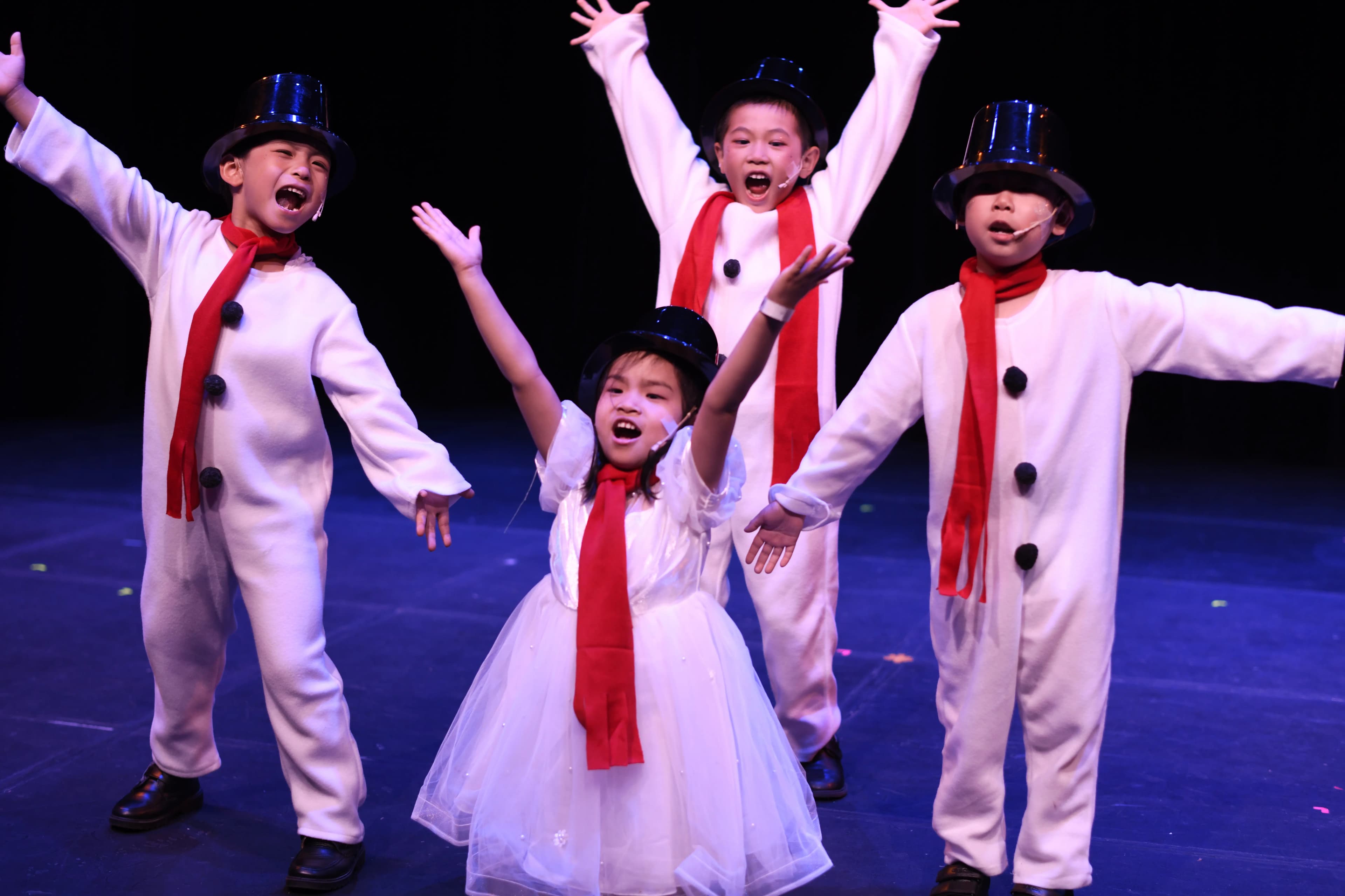 A group of Snowmen celebrating triumphantly, with arms outstretched in the air.