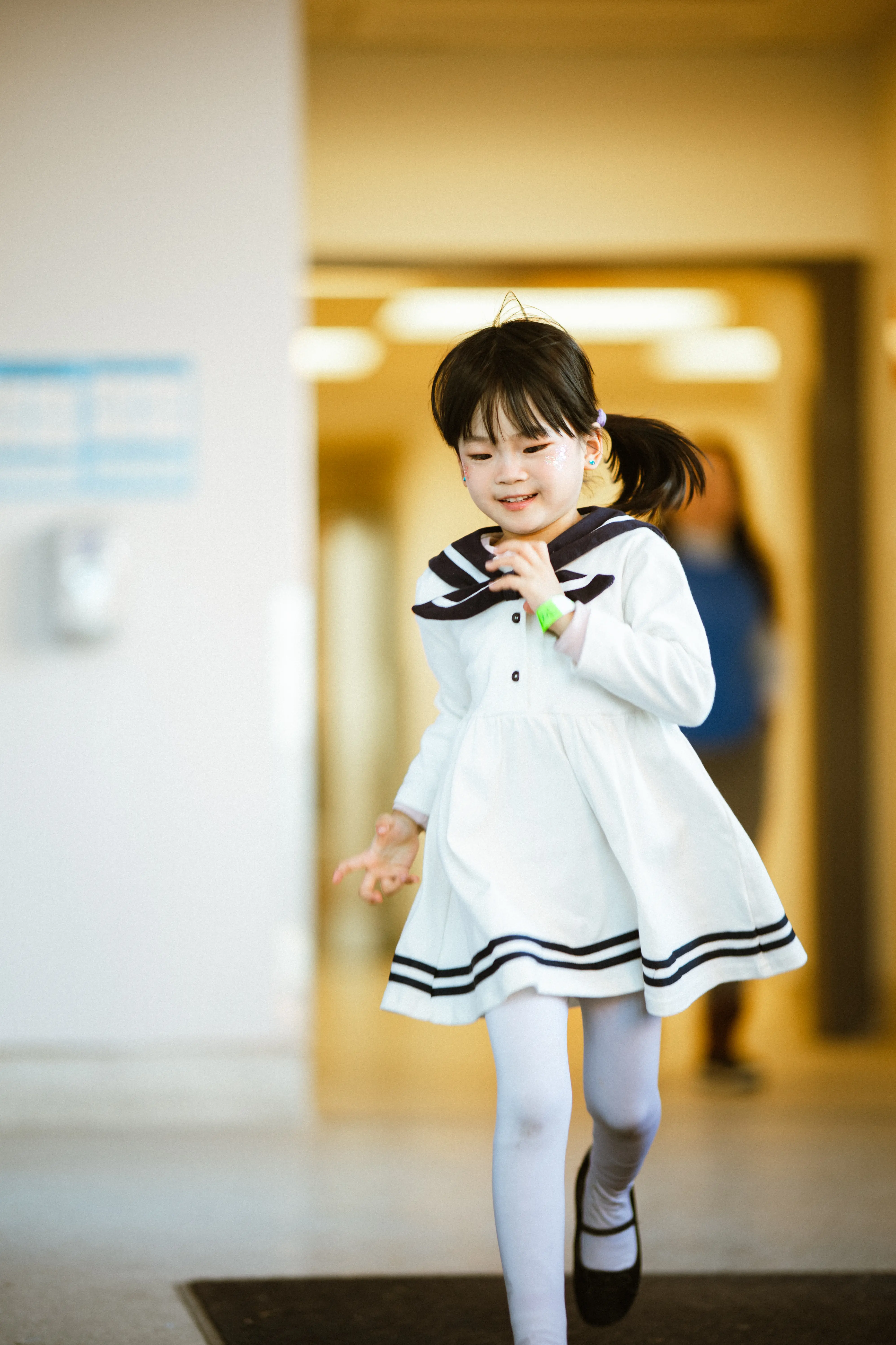 A young TADA student moving through the studio in costume.